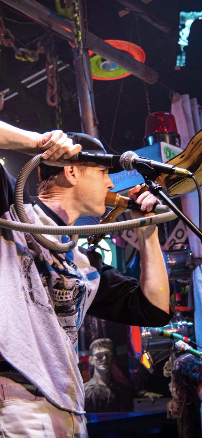 IMP performing with a horn and flexible tube